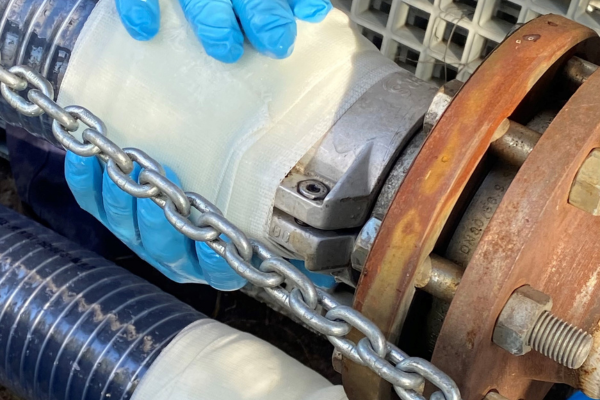 industrial motor, chain, gloves, metal coupling, rusty hardware