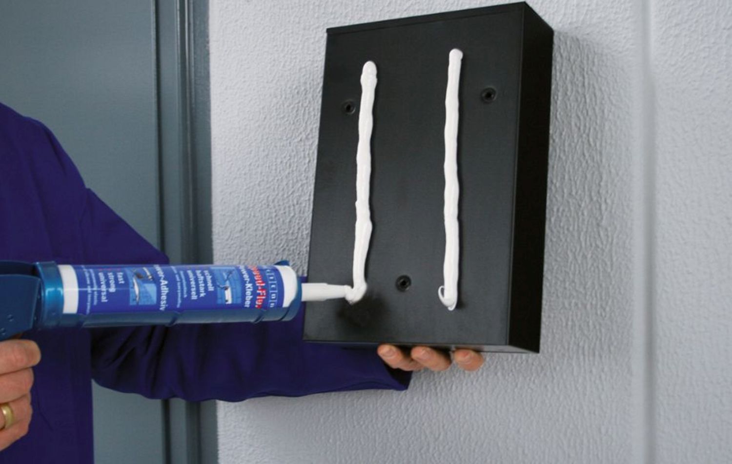 construction adhesive, caulk cartridge, white sealant, caulking gun, black panel