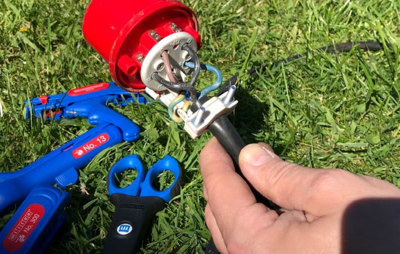 wire stripper, electrical connector, cable scissors, blue plastic handles, red connector