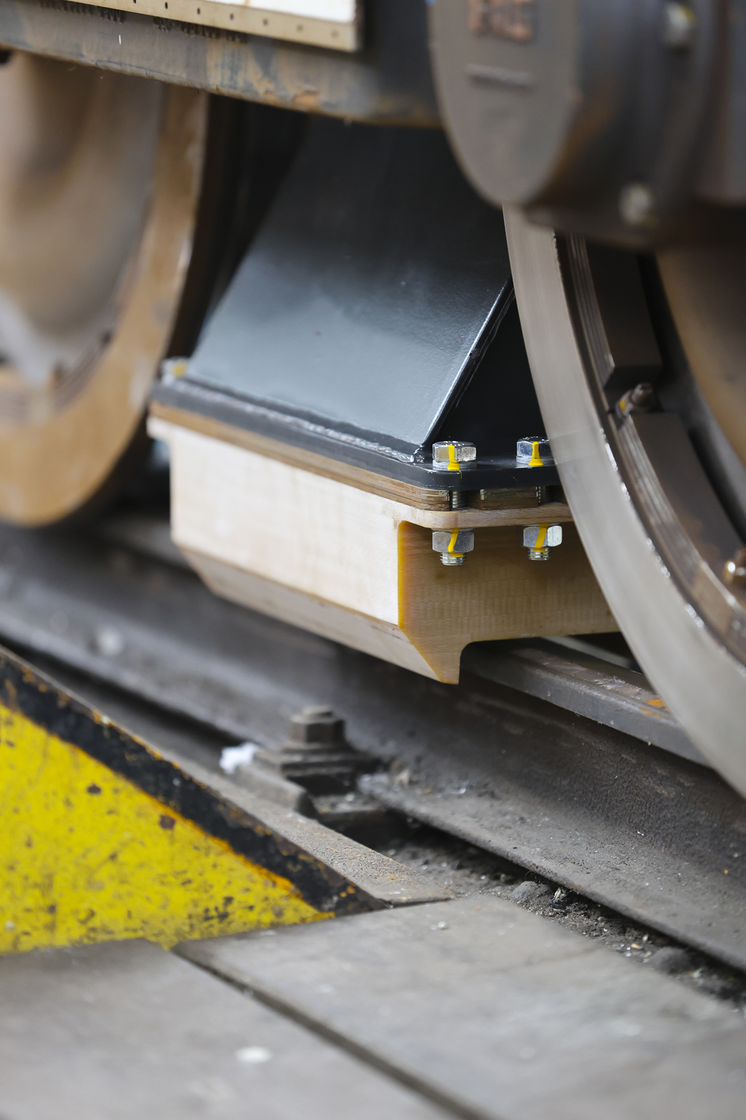 railway, train wheel, metal beam, bolted joint, wood block