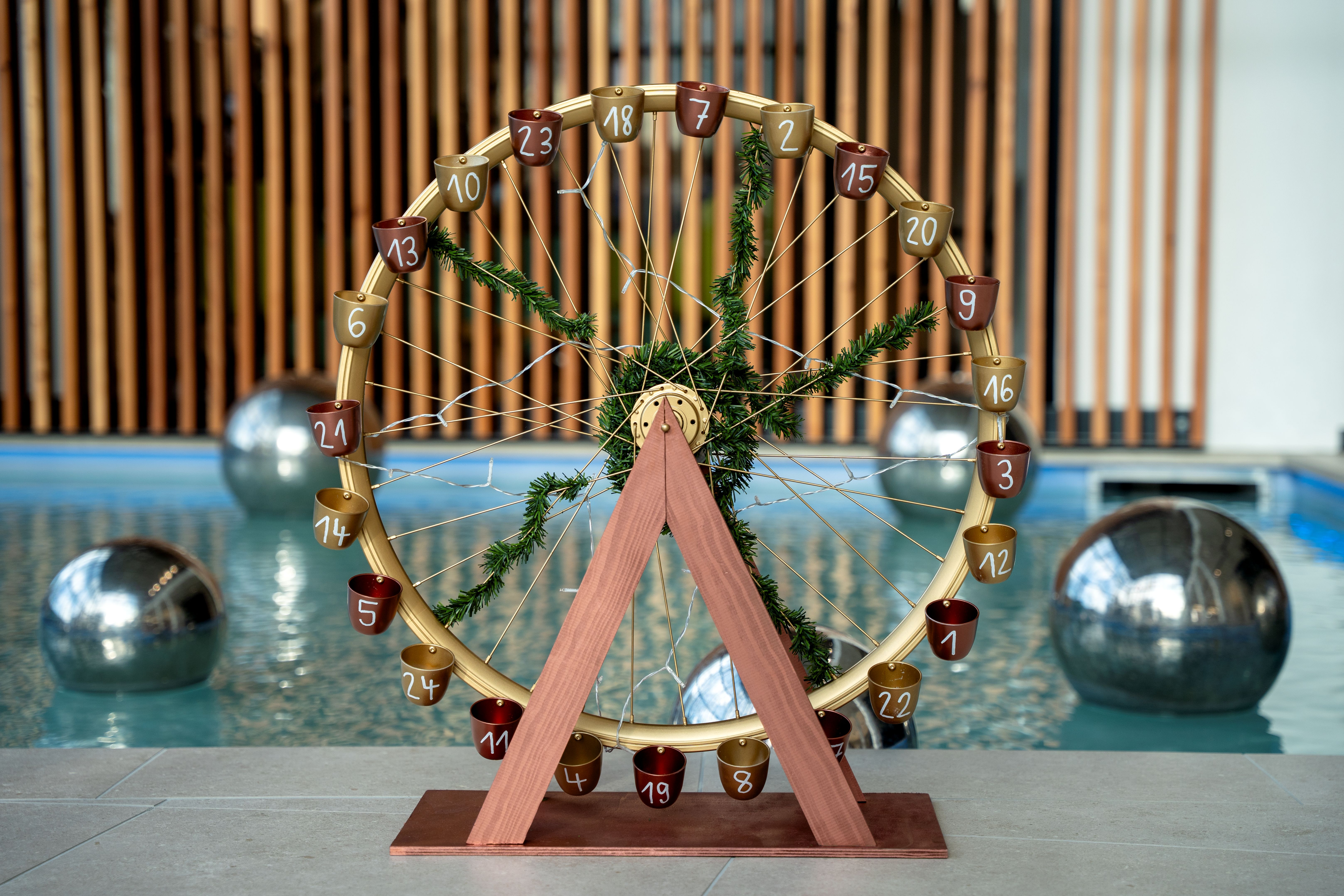 advent calendar, ferris wheel, wooden structure, metal cups, numbers